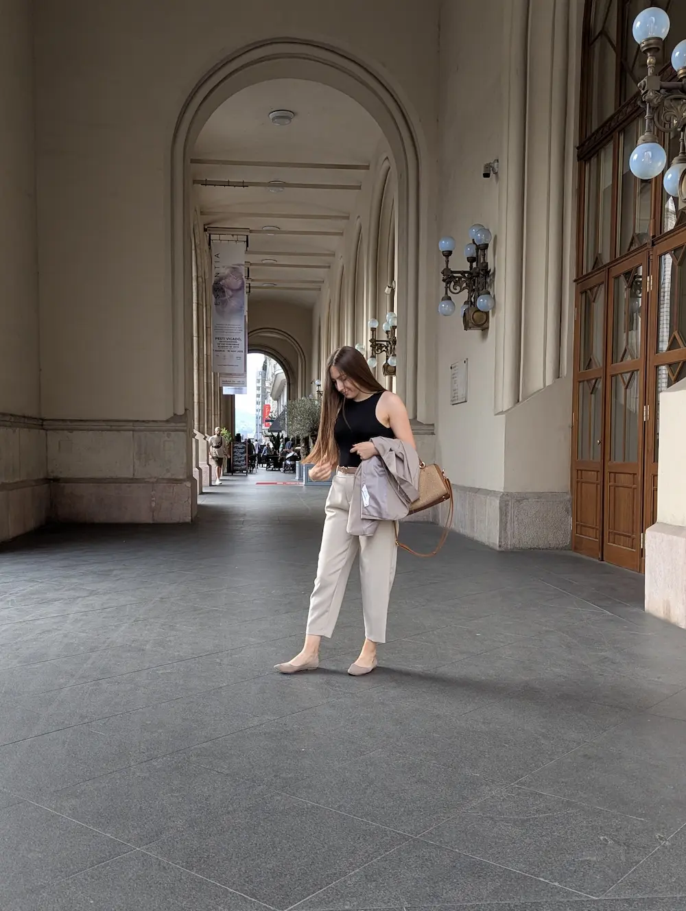 Milica walking through an arcade